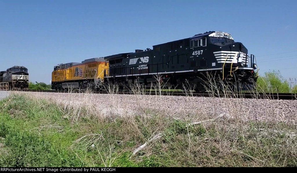 NS 4587 and UP 6367 head south on the Wabtec Test Track towards the Wabtec Locomotive Plant.